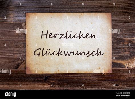 Old Grungy Paper With German Text Herzlichen Glueckwunsch Means