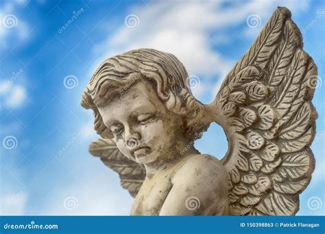 Statue of a Grey Stone Angel Against Blue Sky Stock Image - Image of ...