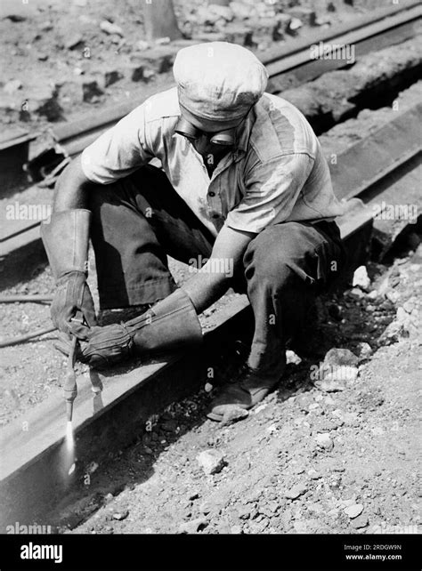 United States C 1935 A Man Working At Dismantling Railroad Tracks By