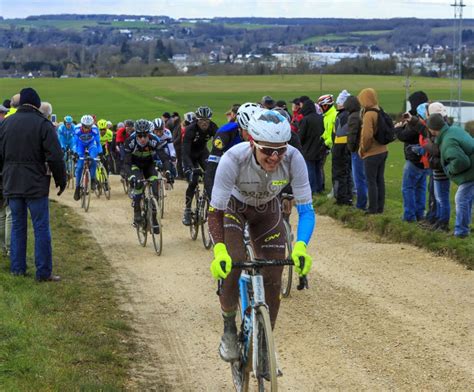 The Peloton On A Dirty Road Paris Nice 2016 Editorial Stock Image