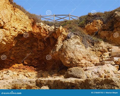 Typical Algarve Beach With Red Cliffs Praia Maria Luisa In Portugal