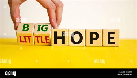 Little Or Big Hope Symbol Hand Turns Wooden Cubes And Changes Words