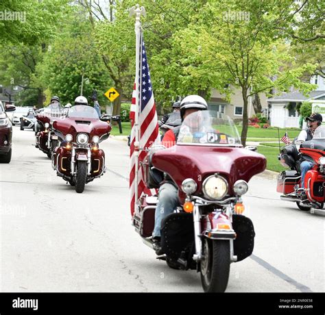 American Legion Riders Lead The Way During A Drive By Parade