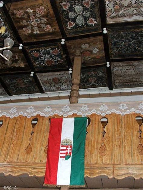 An Italian Flag Hanging From The Ceiling In A Room With Wooden Paneling