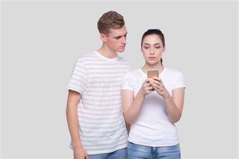 Girl Chatting On Phone Couple Using Phones Standing Isolated Couple