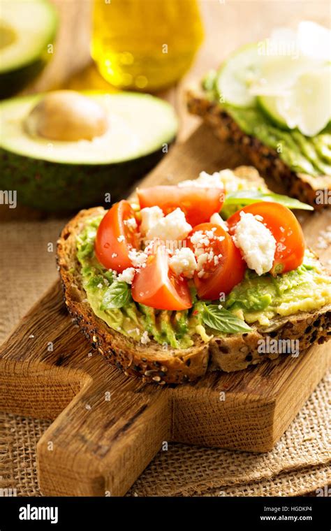 Avocado Toast With Cherry Tomatoes And Feta Cheese Stock Photo Alamy