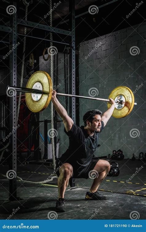 Asian Strong Athletic Man Having Workout And Bodybuilding With Barbells