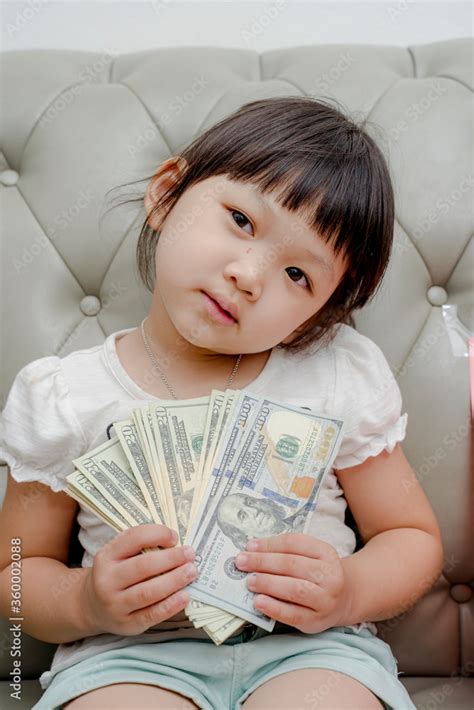 little girl reading a book Stock Photo | Adobe Stock