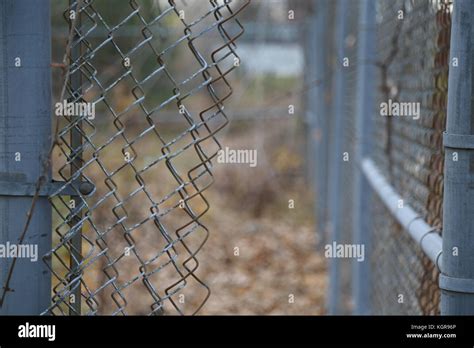 A Break In Chain Link Fence Stock Photo Alamy