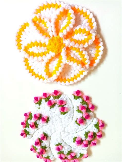 Two Crocheted Doily Designs On A White Surface One With Pink And