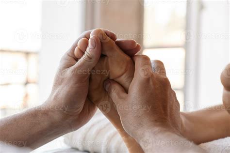 Foot Reflexology Massage Male Masseur Performs Acupressure On A Woman