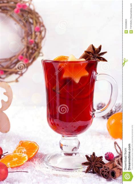 Christmas Mulled Wine With Oranges And Spices On Snow Background Stock