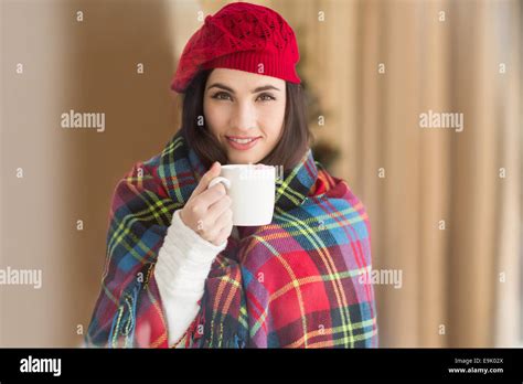 Brunette With Cover Holding Mug Stock Photo Alamy