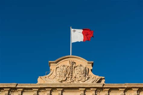 Premium Photo Flag Of Malta The Coat Of Arms Of Castille And Leon On