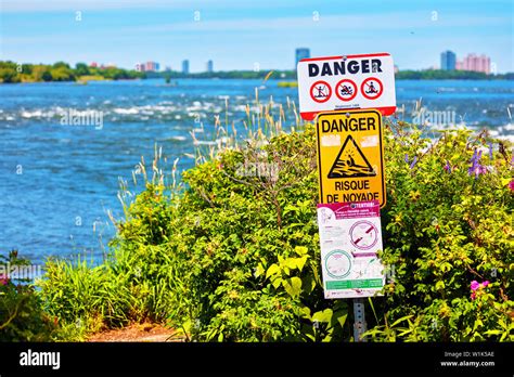 Rapids warning sign against river background in lachine rapids park in ...