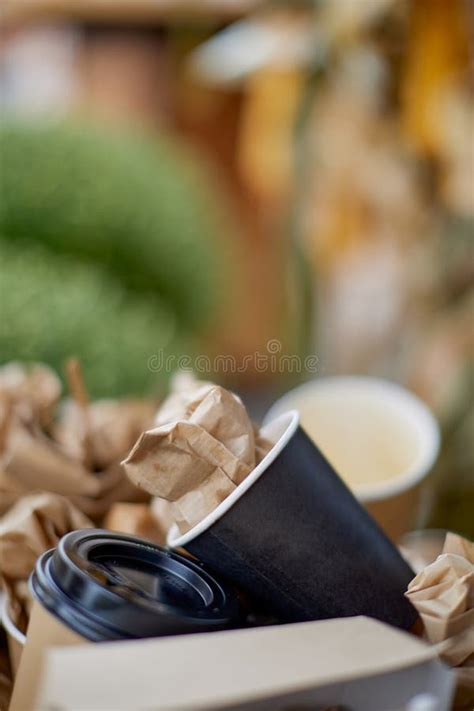 Photo Of Used Disposable Tableware In The Trash Can Stock Photo