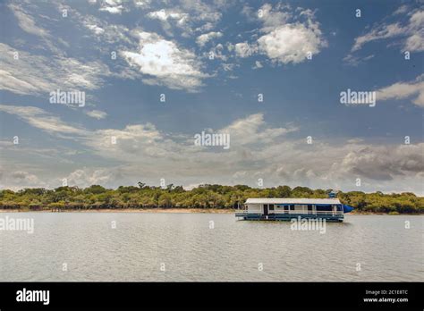 Floating house on Amazon river Stock Photo - Alamy