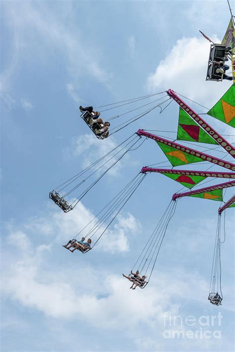 Riders On A Swing Carousel At A County Fair Photograph By William Kuta