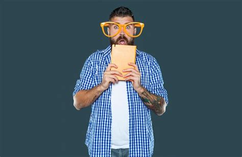 Premium Photo Shocked Funny Bearded Man In Party Glasses Hold Book