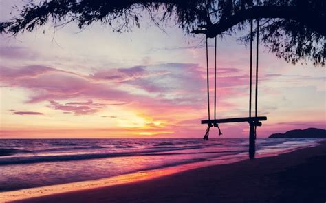 Premium Photo Silhouette Empty Swing At Sunset Beach