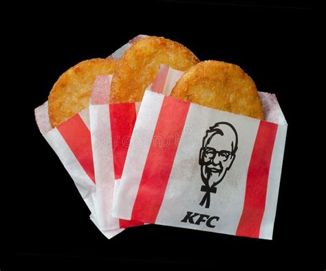 Kfc`s Potatoes Crispy Hash Browns In Package On Black Background