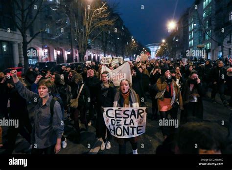 Feminist Activists Holding Signs Demonstrate Outside The Salle Pleyel