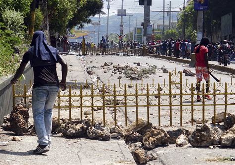 Protesters in Haiti burn businesses in push to oust leader