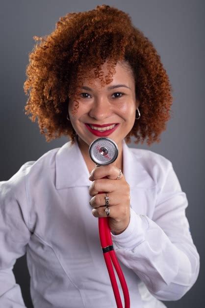 Premium Photo Portrait Of A Female Veterinarian With Red Hair Wearing