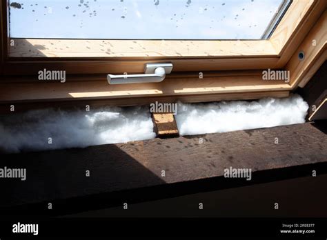 Fiberglass Cavity Insulation Around Attic Window Uk Stock Photo Alamy