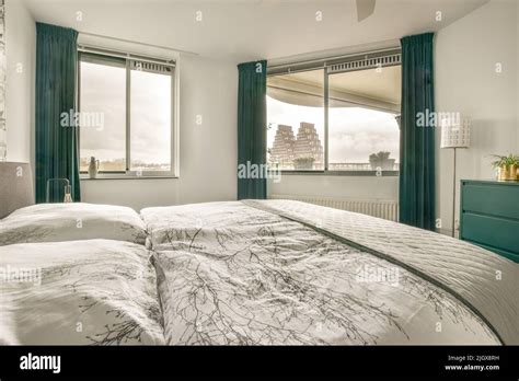Home Interior Design Of Bedroom With Bed And Wooden Wardrobe Placed In
