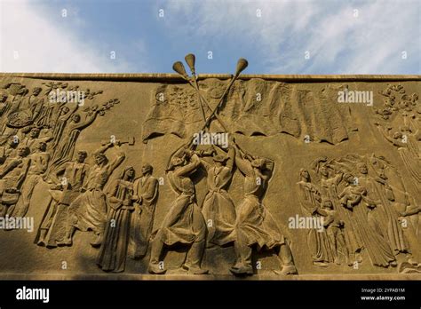A Large Wall With A Painting Of People Holding Flags Stock Photo Alamy