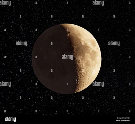 Photograph Of Moon In The First Quarter Lunar Phase Stock Photo Alamy