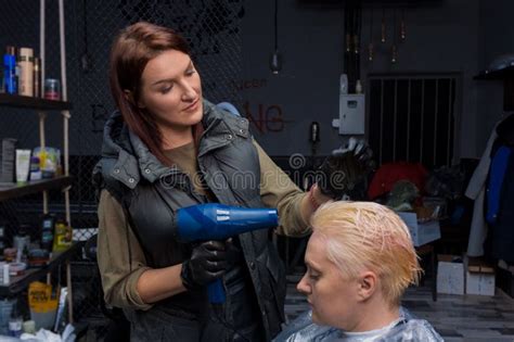 Cute Attractive Adult Brunette Girl Barbershop Worker Blow Drying Hair To Female Client In The