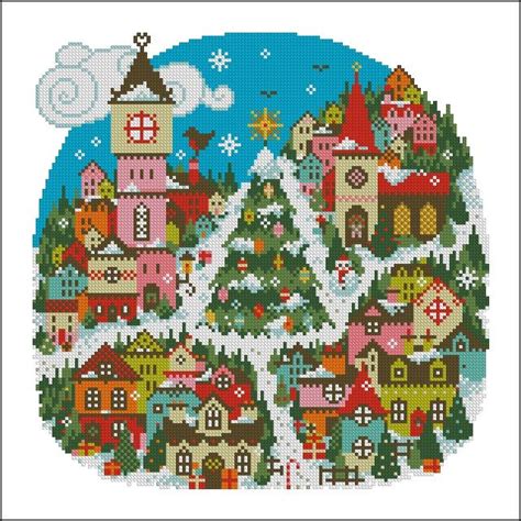 A Cross Stitch Christmas Scene With Houses And Trees