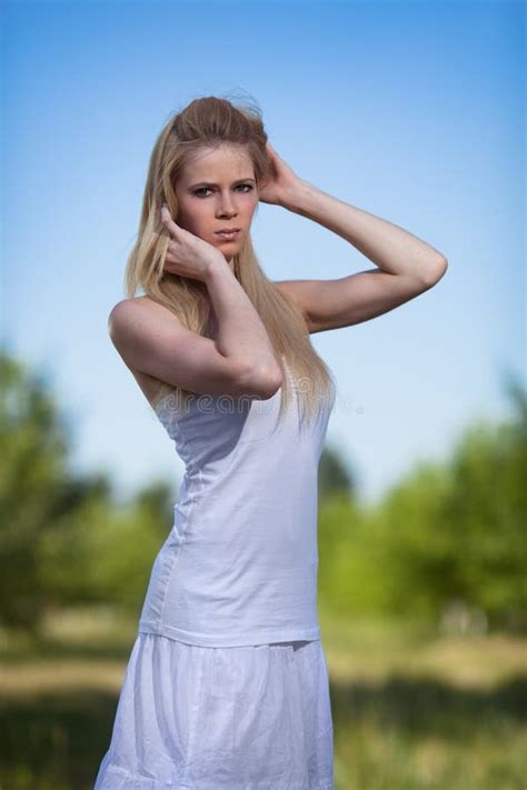 Beautiful Blonde Woman In Park Stock Photo Image Of Feminine Posing