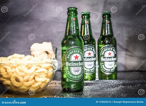 Heineken Cold Beer Bottles With Snacks In The Background Editorial