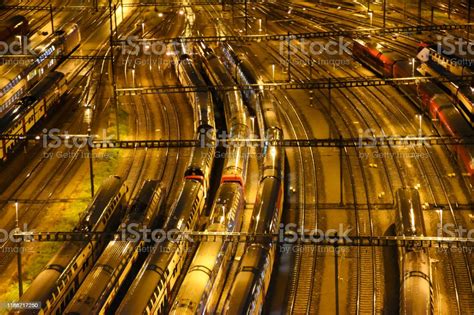 Aerial View Of Freight Cargo And Passenger Trains Waiting At The Train