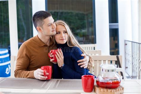 Husband And Wife On Holiday Drink Hot Chocolate Coffee Tea Stock Image Image Of Lights