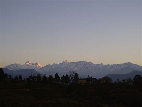 snow capped mountains  weathered building  dusk  stock photo