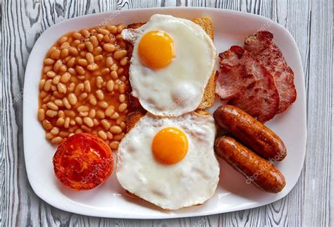 English breakfast with two eggs sausage beans Stock Photo by ...