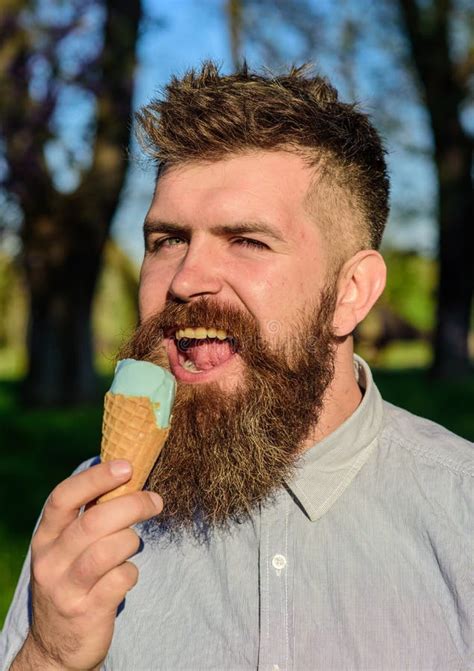 Chilling Concept Man With Long Beard Licks Ice Cream Close Up Man