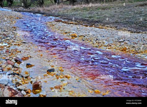 Contaminated mine water pollution of a copper mine exploitation Stock Photo - Alamy