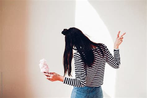 Girl Holding Ice Cream Cone Indoors By Stocksy Contributor Pink