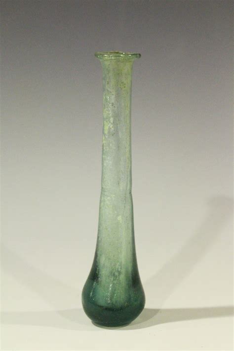 A Roman Glass Teardrop Perfume Phial Of Elongated Bottle Form With