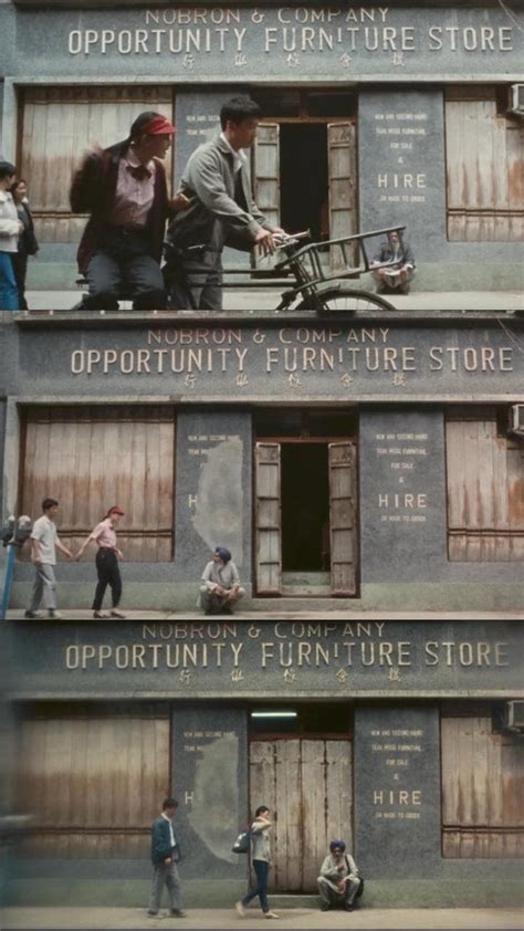 Three Story Building With People Standing On The Windows