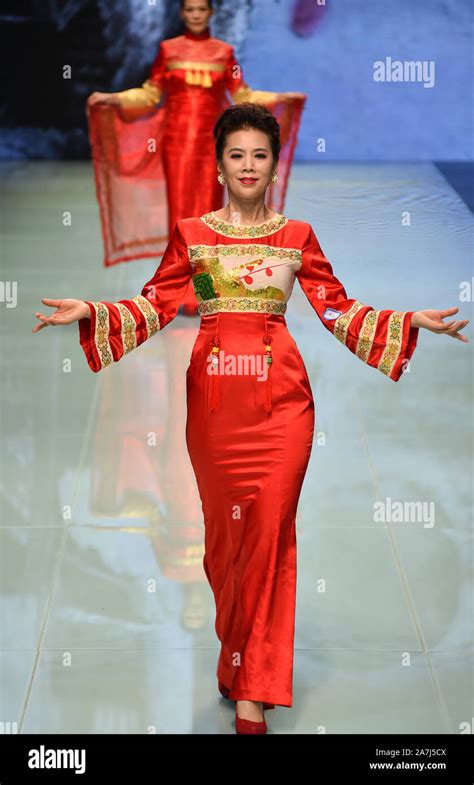 Elder models wearing traditional Chinese outfit designed by Chen Fumei ...