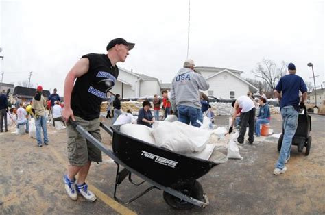 | Residents Preparing Sandbags for Flood Protection