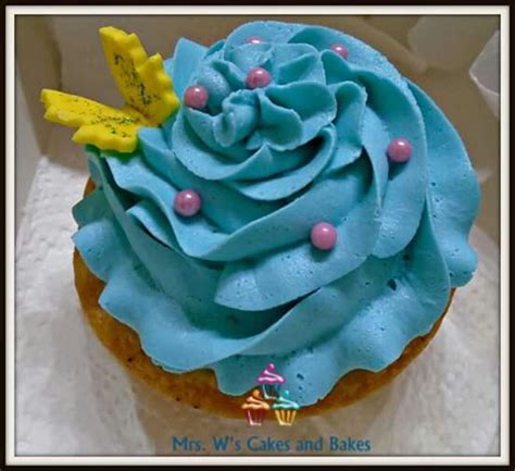 Yellow Cupcake With Blue Frosting Blue Frosting Desserts Yellow Cupcake