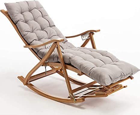 A Wooden Rocking Chair With Grey Cushions On It S Back And Seat Cushion