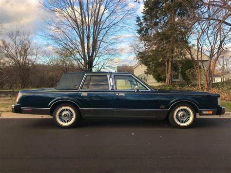 Blue Lincoln Town Car On Vogues